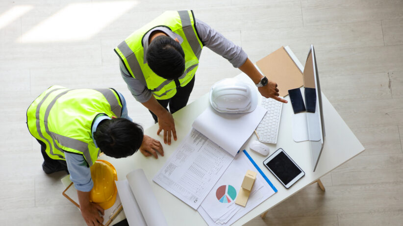 Two engineers working on cost certainty at WT India